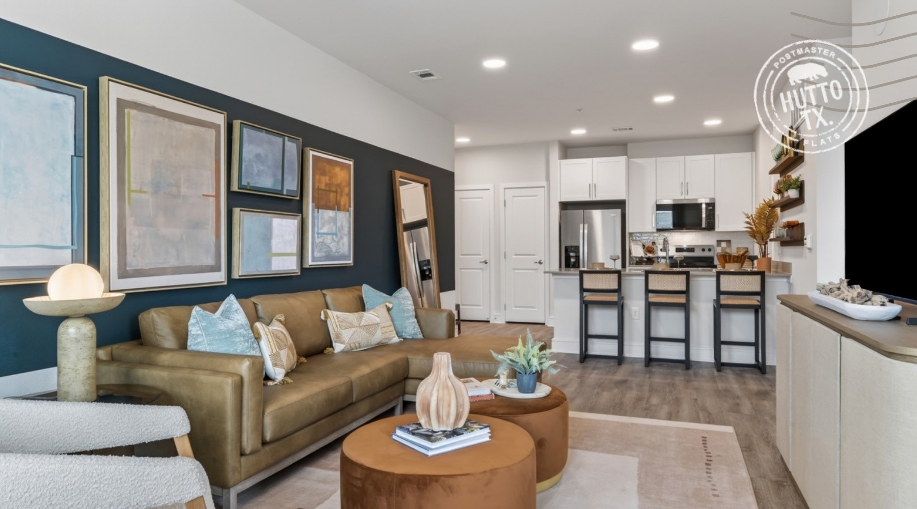 living room with furniture and view of a kitchen