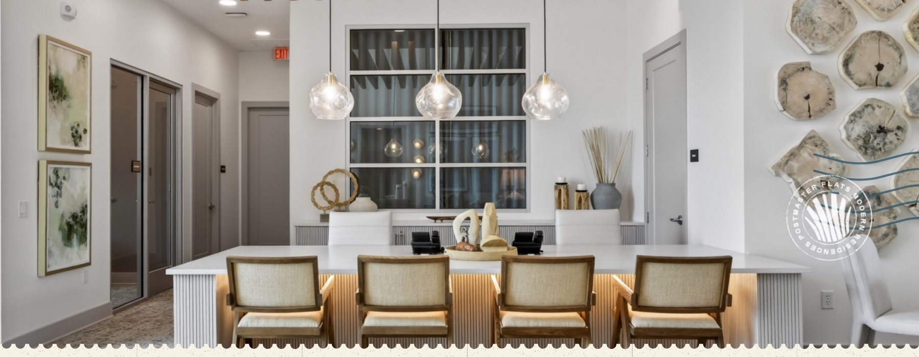 a large table with seating and pendant lighting above