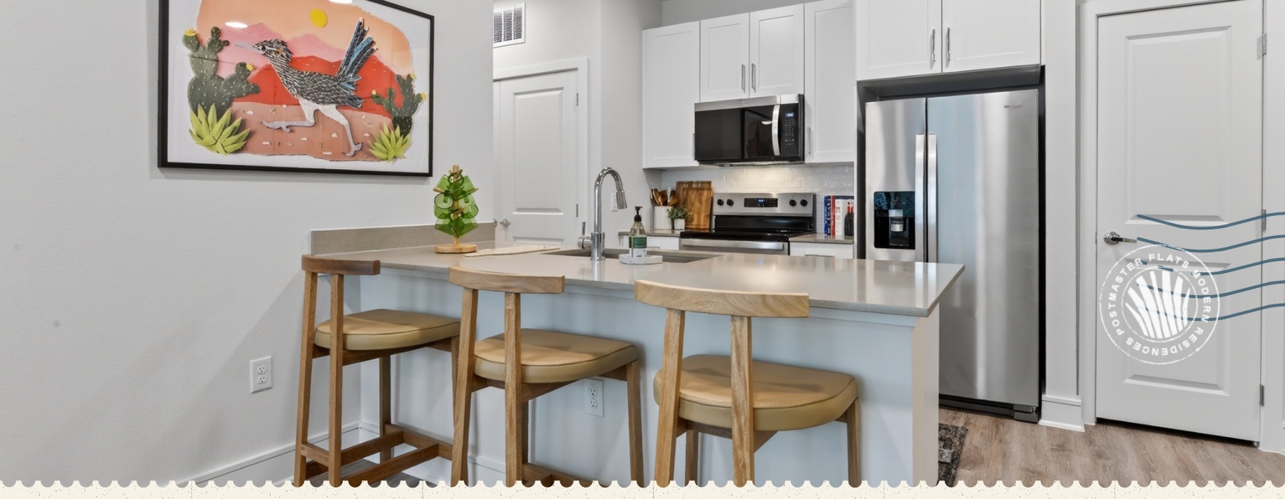 kitchen with stainless steel appliances and white cupboards